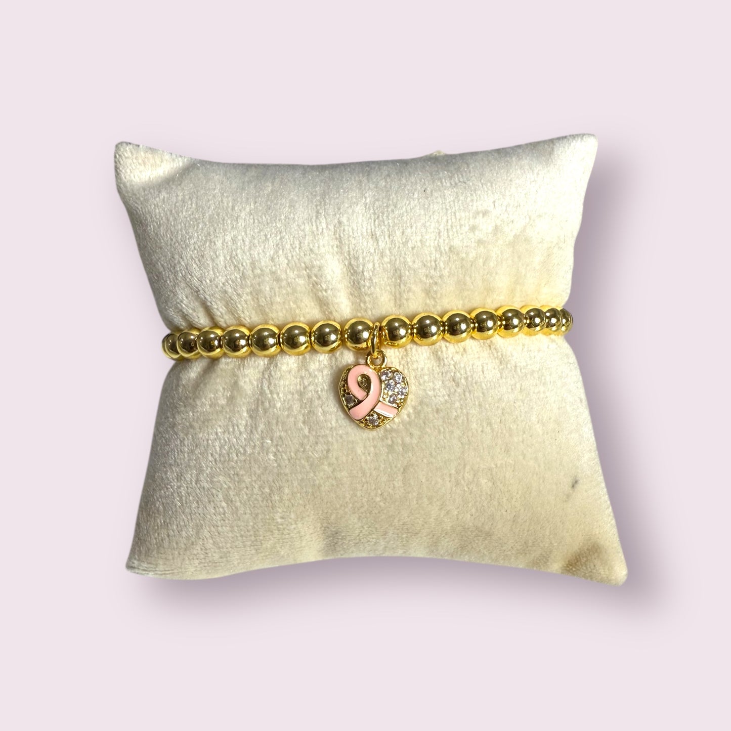 Elegant Breast Cancer Bracelet featuring a pink ribbon charm, perfect for raising awareness and support.