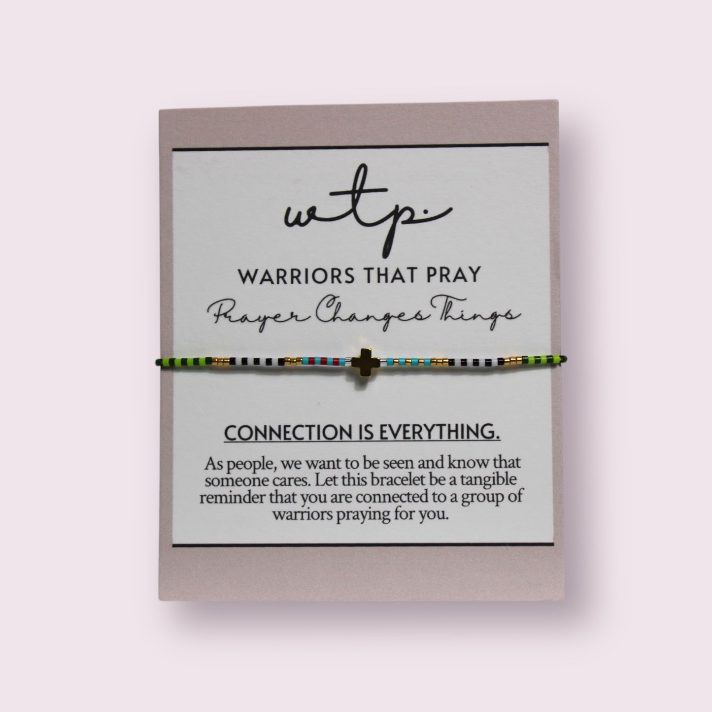 Stunning Unshaken Bracelet featuring an 18k gold plated cross and adjustable string, perfect for meaningful connections.