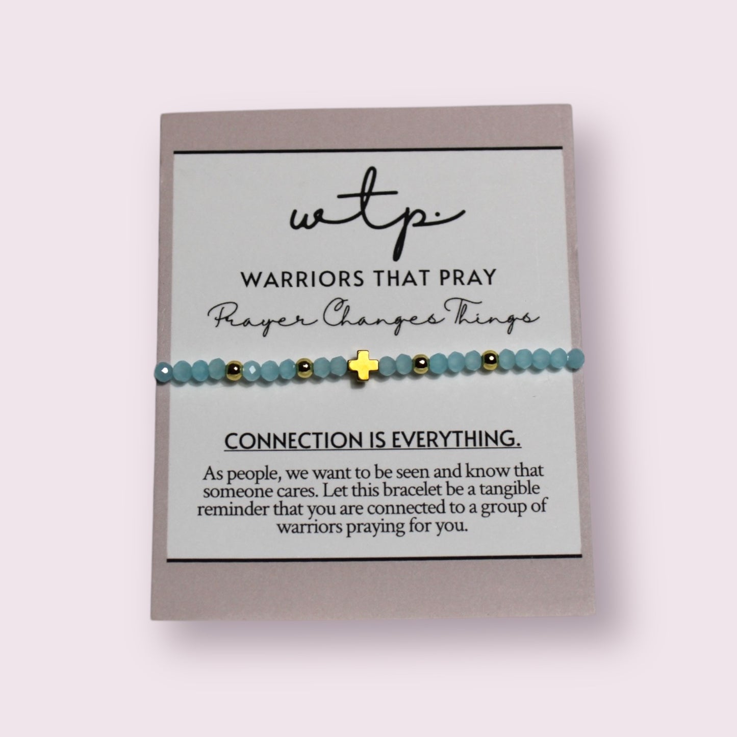 Light blue Beacon Bracelet features delicate beads and gold accents, perfect for a meaningful connection.
